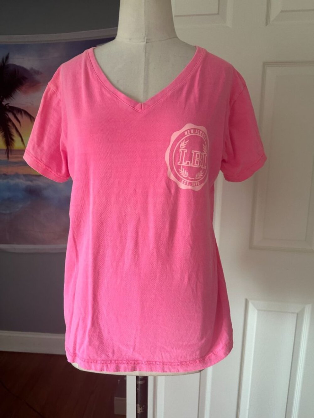 Hot pink V neck t-shirt with LBI New Jersey logo on front by Exist Small